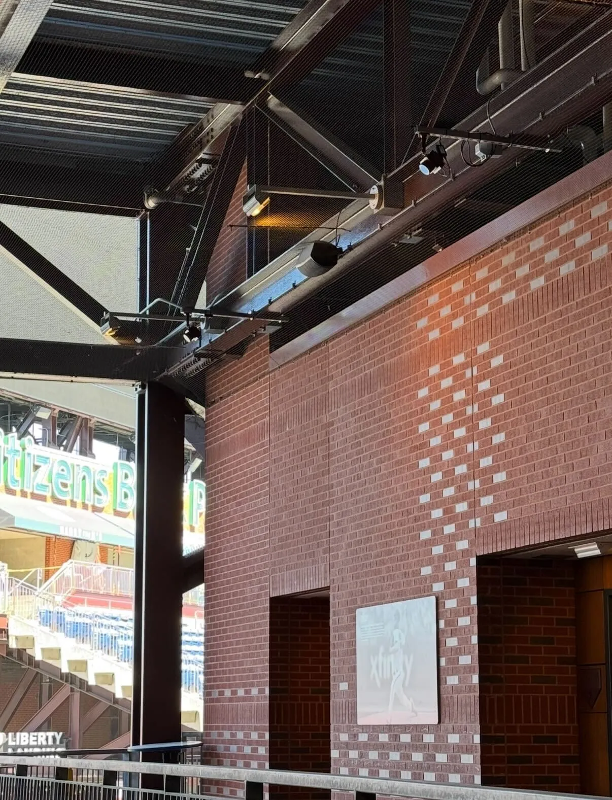 Queues sensors mounted on the steel beams of a ballpark concourse
